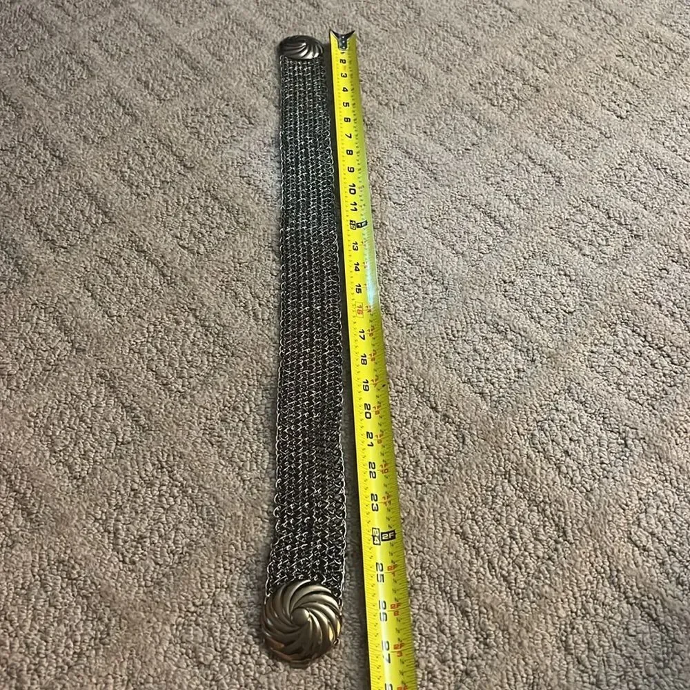 Metallic black and gold woven belt with metal buckle